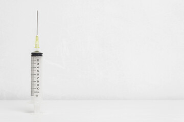 A syringe on the background, covid concept.