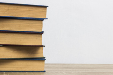 A pile of books on table with copy space