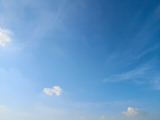Blue sky with smooth clouds background.