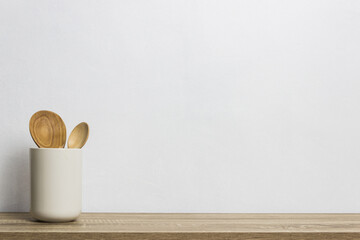 A wooden kitchen utensils on wooden table