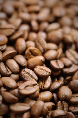 Coffee beans. Roasted coffee close-up.Texture of coffee beans. space for text.Arabica and Robusta coffee variety.Traditional morning drink