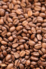 Coffee beans background. Roasted coffee.Texture of coffee beans. space for text.Arabica and Robusta coffee variety.Traditional morning drink