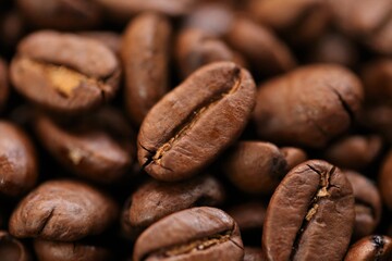 Coffee beans . Roasted coffee close-up.Texture of coffee beans. space for text.Arabica and Robusta coffee.Traditional morning drink