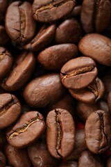 Coffee beans background. Roasted coffee close-up.Texture of coffee beans.Arabica coffee variety.Traditional morning drink