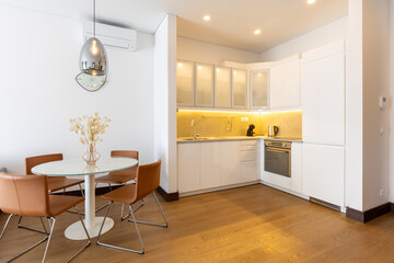 Interior of a modern kitchen with dining area