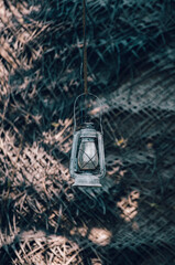 Hurricane lantern hangs outside the village cabana house,