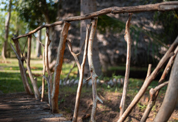 Fototapeta premium Small bridge made from tree branches in a garden for mainly for décor.