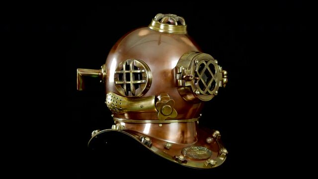 Antique vintage USA marine deep sea diver boston brass and copper helmet. A nautical diving underwater breathing helmet.