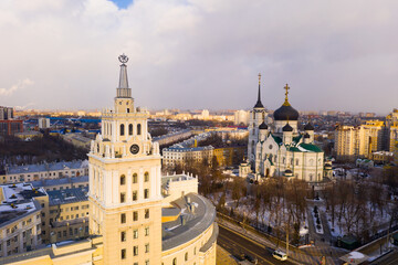 Fototapeta premium Aerial view of the Annunciation Cathedral and the tower of the Southern Railway building on the central street of ..Voronezh in winter, Russia