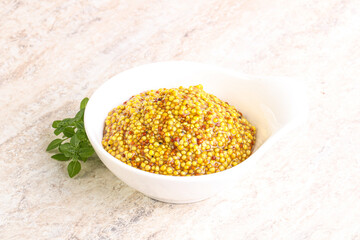 Grain mustard sauce in the bowl