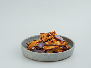 Stir fried brinjal in a grey dish eggplant