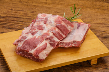 Raw pork ribs served rosemary