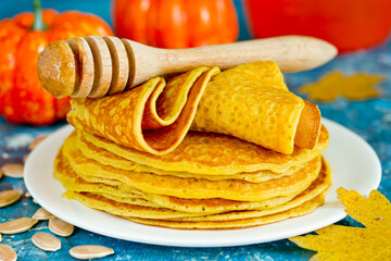 Pumpkin pancakes , stack of delicious pumpkin pancakes on white plate