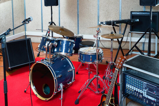 Fashionable stylish music instruments and equipments for rock band in empty rehearsal room