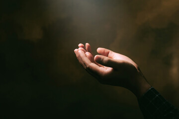 Human hands open palm up worship with faith in religion and belief in God on blessing...