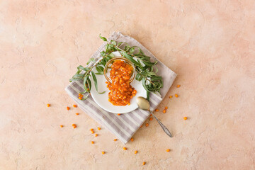 Healthy sea buckthorn jam on color background