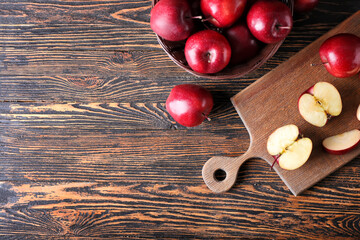 Fresh red apples on wooden background