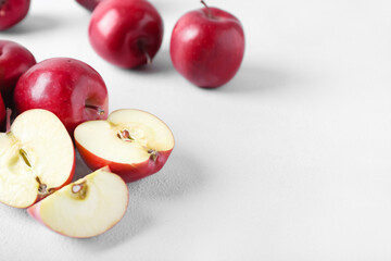 Fresh red apples on light background
