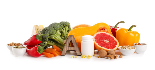 Healthy products rich in vitamin A on white background