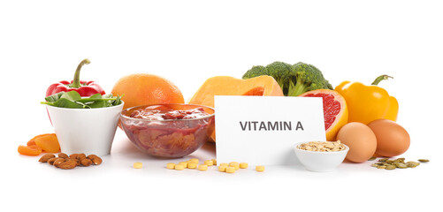 Healthy products rich in vitamin A on white background