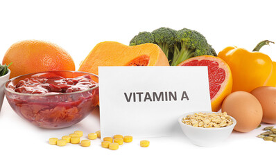 Healthy products rich in vitamin A on white background