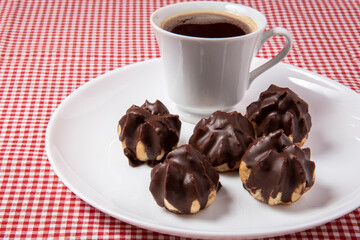 cup of coffee and chocolate eclair