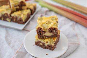 Home made rhubarb cheesecake chocolate brownie on a table