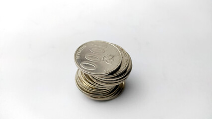 Pile of coins on white backround, stacked coins, rupiah coins