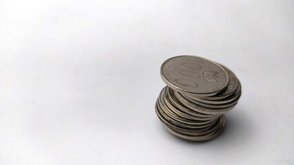Pile of coins on white backround, stacked coins, rupiah coins