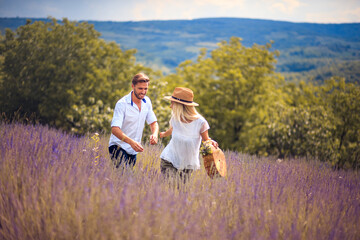 Naklejka na ściany i meble Happy Couple in lavender field.