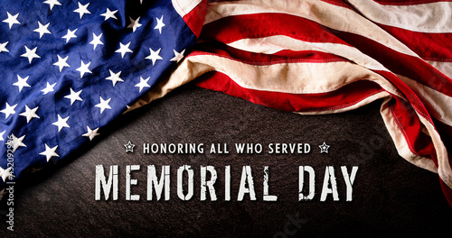Happy memorial day concept made from american flag with text over dark stone background.