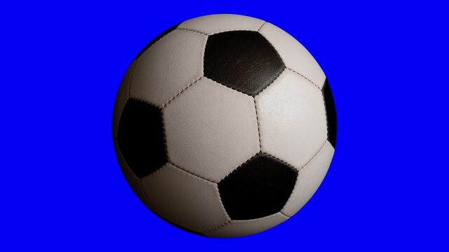 Rotating soccer ball isolated on blue background. Sports football. Alpha channel 3d illustration