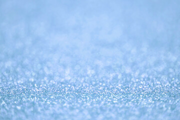 Obraz premium Texture of light blue silver glitter dust surface, luxury background with bokeh