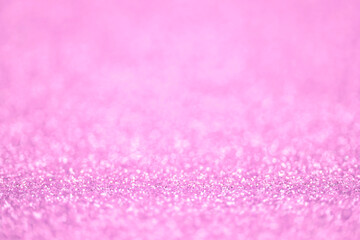 Texture of light pink glitter dust surface, luxury background with bokeh