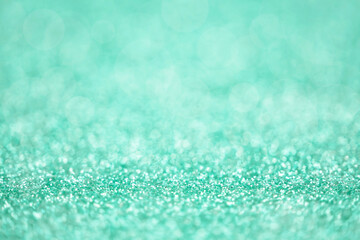 Obraz premium Texture of light green silver glitter dust surface, luxury background with bokeh