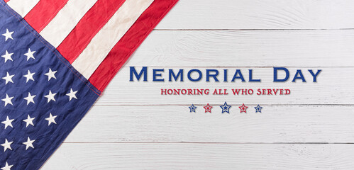 Fototapeta na wymiar Happy memorial day concept made from american flag with text over white wooden background.