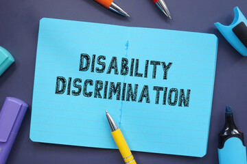 Business concept about Disability Discrimination with phrase on the sheet.