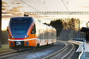 Express orange train. Estonian new train. ecological passenger transport, Fast Light Intercity and Regional Train.
