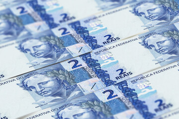 Obraz na płótnie Canvas BRL. Closeup Brazilian real banknotes background