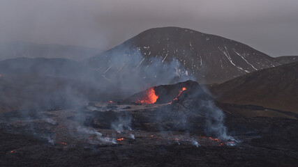 Stunning view of volcanic eruption in Geldingadalir valley near Fagradalsfjall mountain,...