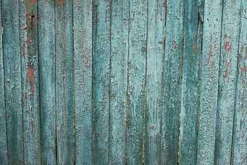 old blue wooden painted cracked fence