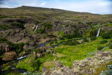  Scenic landscape of Hjalparfoss on the South of Iceland