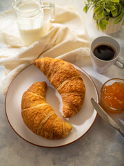 French croissant with jam. morning breakfast. On a light background