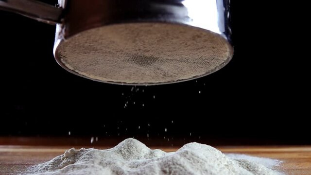 Making cake batter, sifting flour to make it more airy. Super slow motion