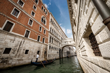 The famous Bridge of Sighs (Ponte dei Sospiri) in baroque style that connects the Palazzo Ducale (Doge Palace) in gothic style, with the Prisons. Veneto, Italy, Europe.