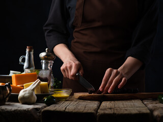 Fototapeta na wymiar Chef Slices Olives Salad Pizza Background Ingredients Culinary Recipes