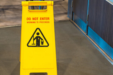 Cleaning in progress caution sign in pathways in the restaurant