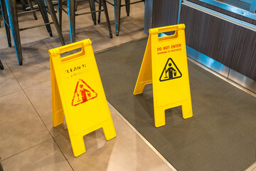 Cleaning in progress caution sign in pathways in the restaurant