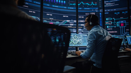 Professional IT Technical Support Specialists and Software Programmer Working on Computers in...
