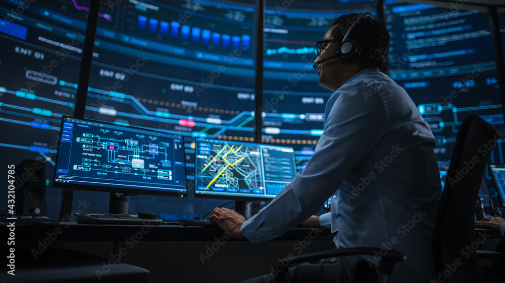 Aufkleber Professional IT Technical Support Specialist and Software Developer Working on Computer in Monitoring Control Room with Digital Screens. Employee Uses Headphones with Mic and Talking on a Call.